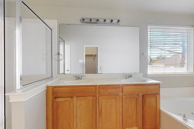 bathroom with a wealth of natural light, vanity, and separate shower and tub