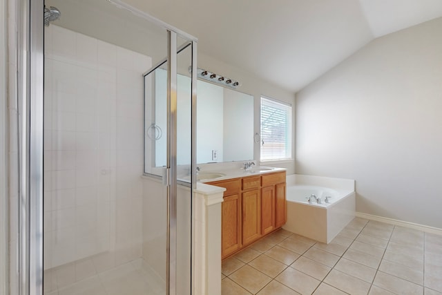 bathroom with independent shower and bath, tile patterned flooring, vaulted ceiling, and vanity