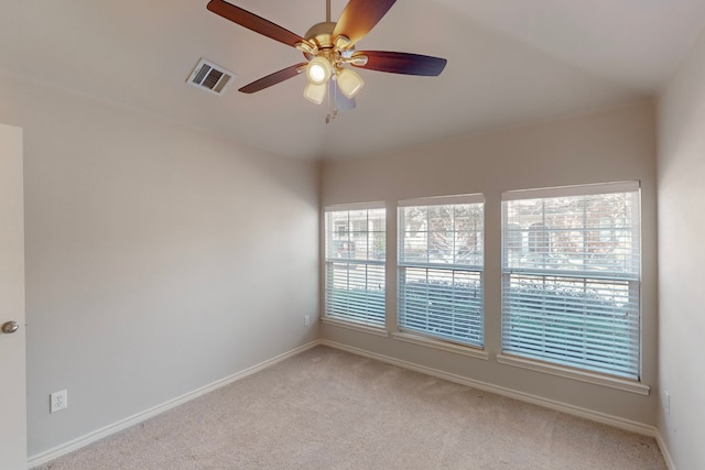 carpeted empty room with ceiling fan