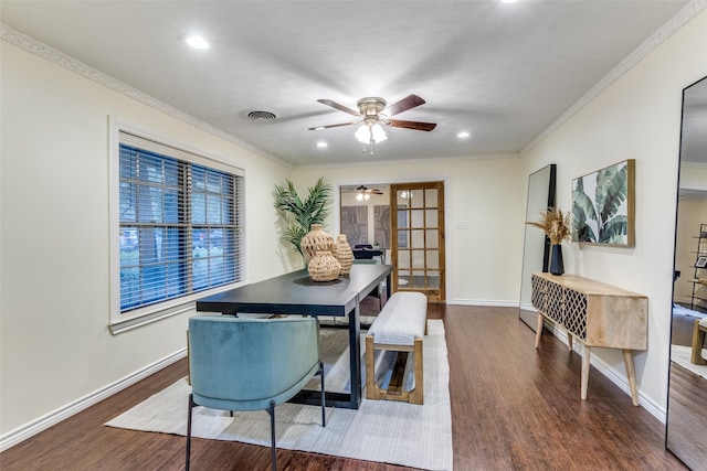 dining area with crown molding, dark hardwood / wood-style flooring, and french doors