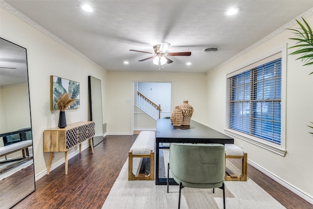 dining area featuring wood-type flooring, ceiling fan, and crown molding