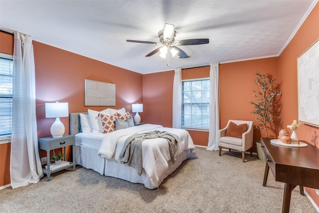 bedroom with ornamental molding, light carpet, and ceiling fan