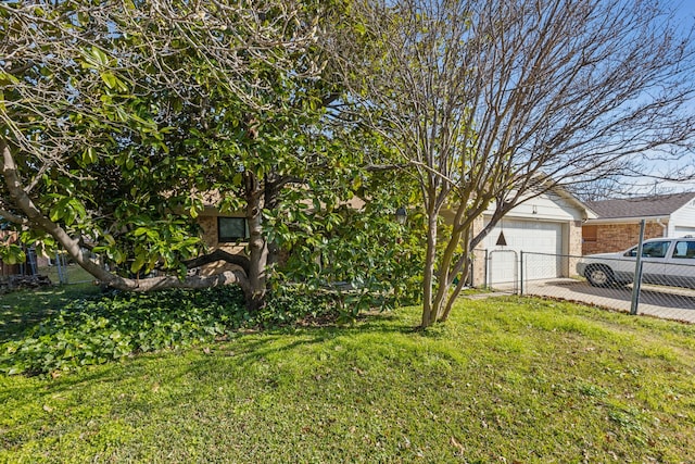 view of front of property with a garage and a front yard