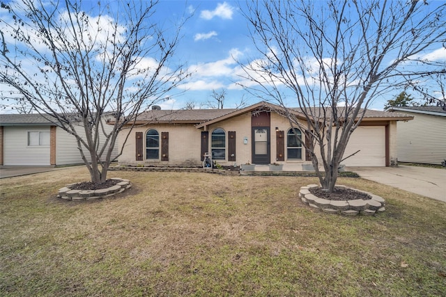 ranch-style home with a garage and a front yard