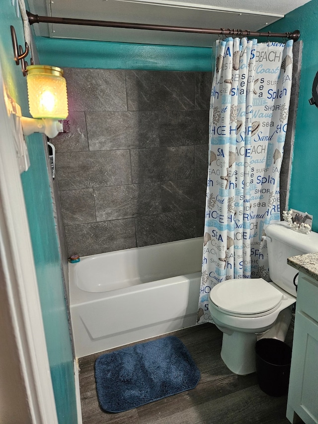 full bathroom with wood-type flooring, toilet, shower / bathtub combination with curtain, and vanity