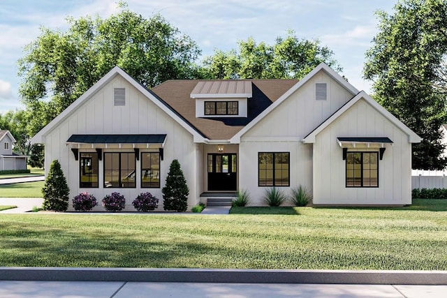 modern farmhouse style home with a front yard