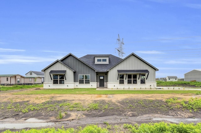 view of front of property featuring a shingled roof and board and batten siding