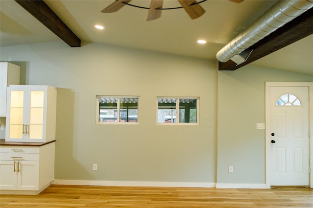 foyer featuring vaulted ceiling with beams, light hardwood / wood-style flooring, and ceiling fan