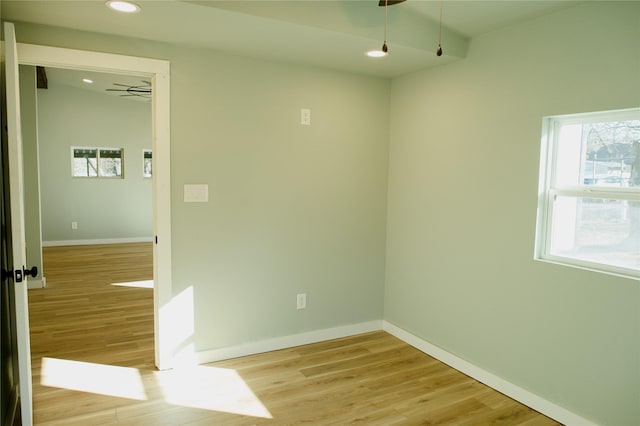 spare room featuring ceiling fan and light hardwood / wood-style floors