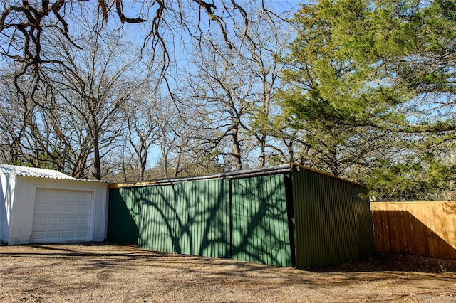 view of outbuilding with a garage