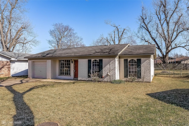 ranch-style home featuring a garage and a front lawn