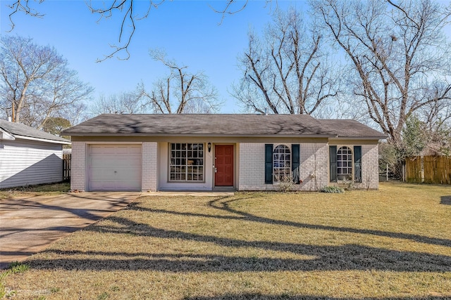 ranch-style home featuring a garage and a front lawn