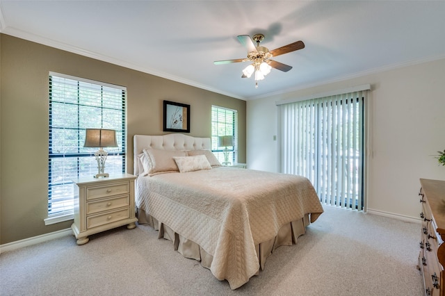 bedroom featuring ceiling fan, light colored carpet, and crown molding