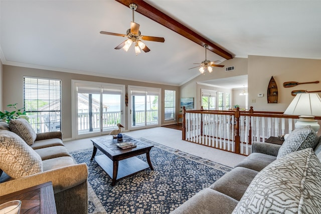 living room featuring light colored carpet, crown molding, lofted ceiling with beams, and a healthy amount of sunlight