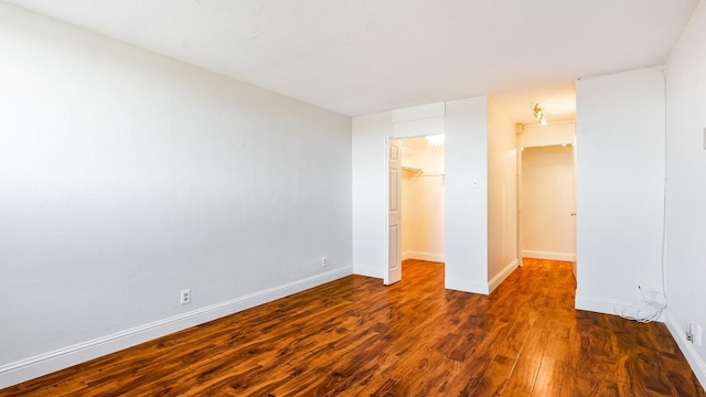 unfurnished room featuring dark hardwood / wood-style floors