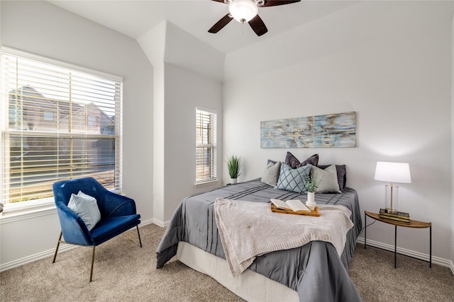 carpeted bedroom with a ceiling fan and baseboards