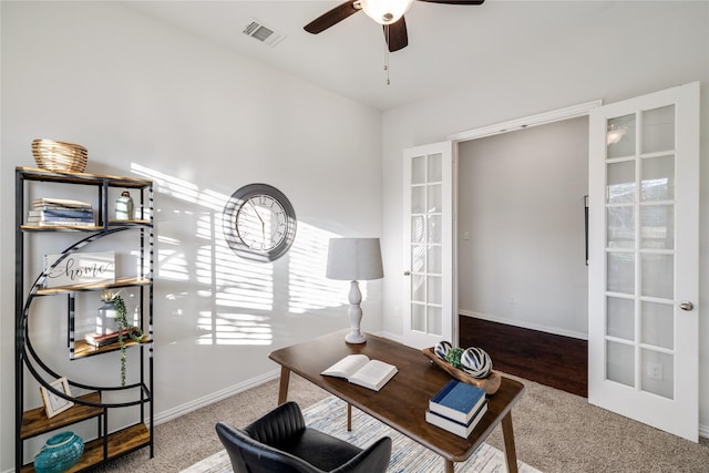 office space with baseboards, visible vents, a ceiling fan, and french doors