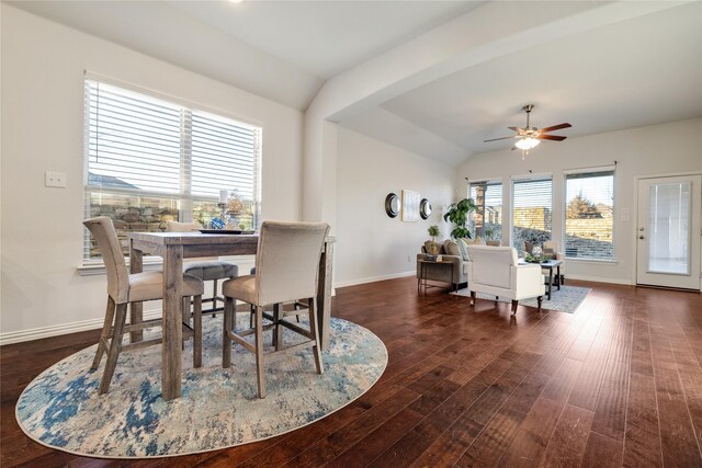 living room featuring vaulted ceiling, dark hardwood / wood-style floors, and ceiling fan