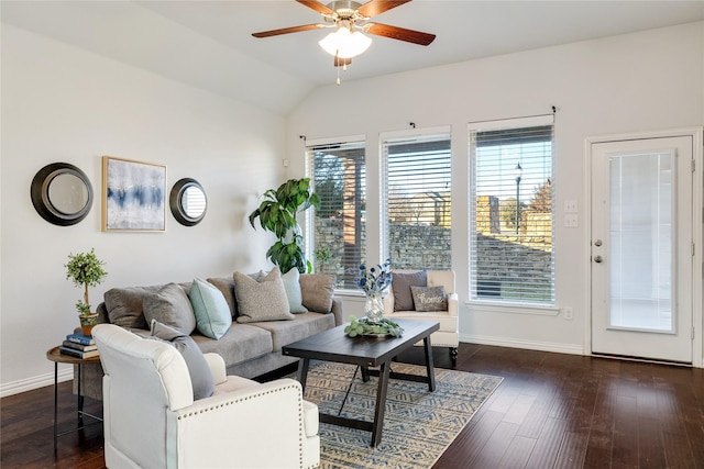 living room with vaulted ceiling, a wealth of natural light, ceiling fan, and dark hardwood / wood-style flooring