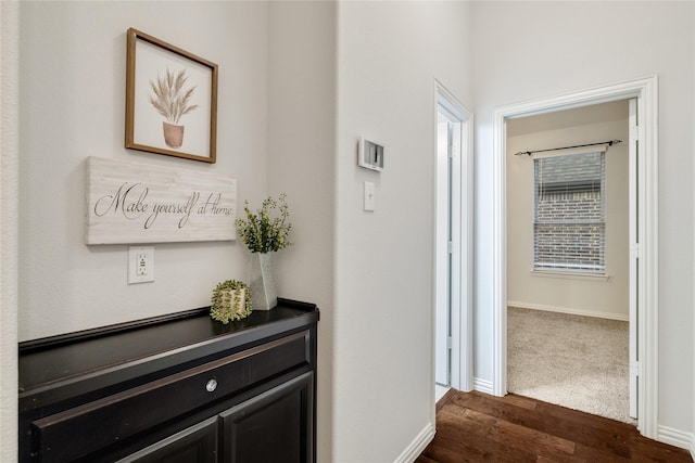 hallway with dark carpet