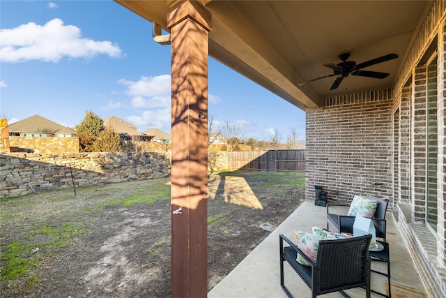 view of patio with outdoor lounge area and ceiling fan