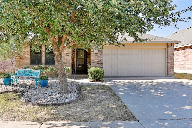 obstructed view of property with a garage