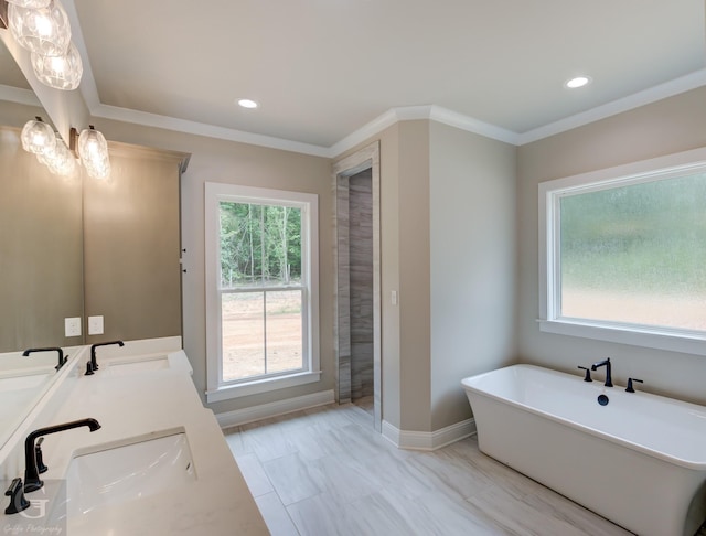 bathroom with crown molding, a tub to relax in, and vanity