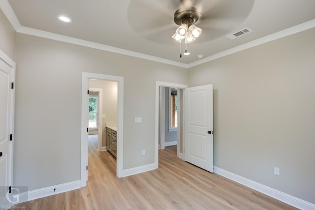 unfurnished bedroom featuring ceiling fan, light hardwood / wood-style flooring, and crown molding