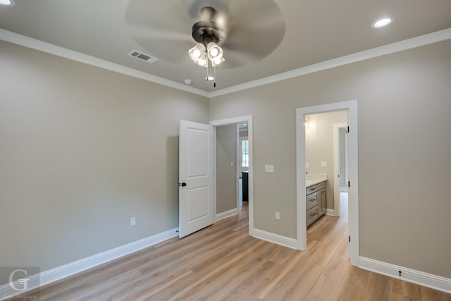 unfurnished bedroom featuring ceiling fan, light hardwood / wood-style floors, and crown molding