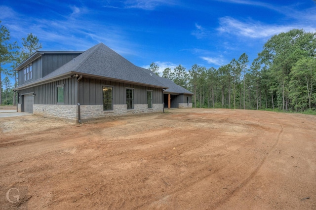 view of side of property featuring a garage