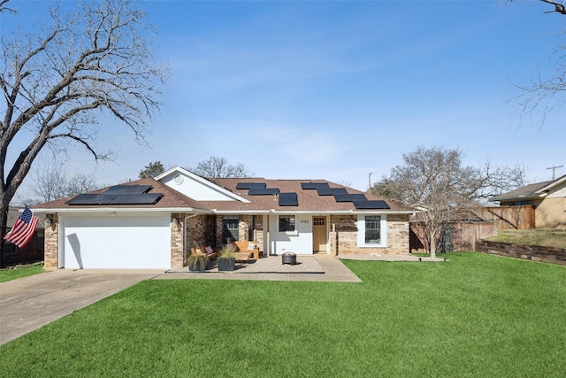 view of front facade with a garage, a front lawn, and solar panels