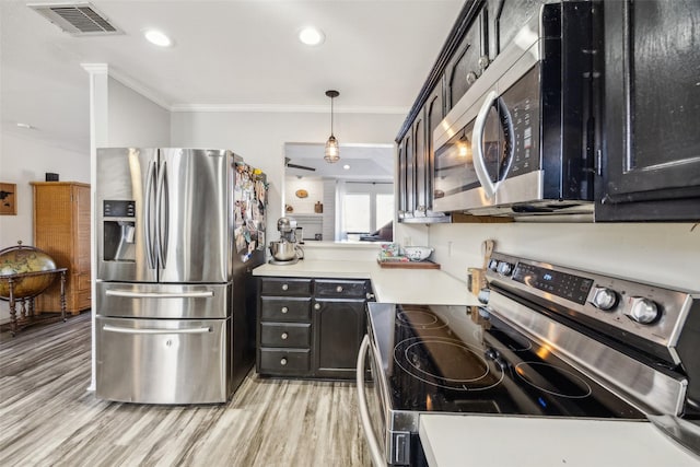 kitchen with crown molding, decorative light fixtures, light hardwood / wood-style flooring, and stainless steel appliances