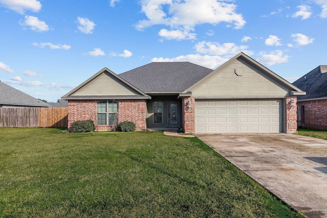 single story home featuring a garage and a front yard