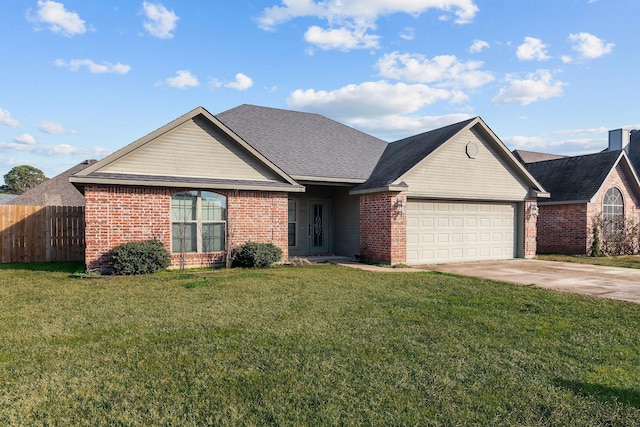 single story home featuring a garage and a front lawn