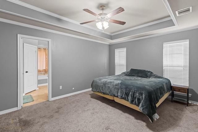 bedroom featuring a raised ceiling, ornamental molding, light carpet, and ceiling fan