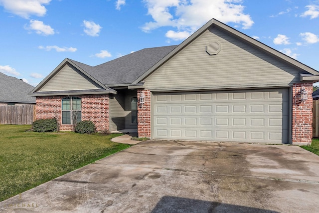 single story home featuring a garage and a front lawn