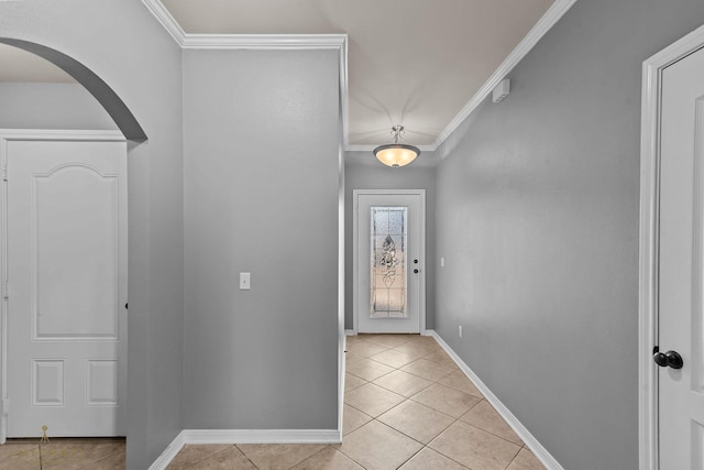 tiled foyer featuring ornamental molding