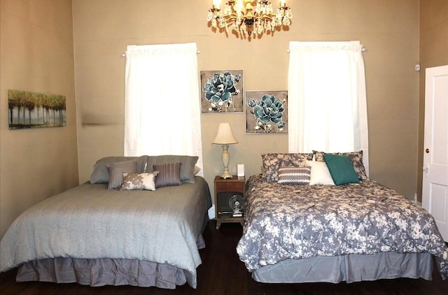 bedroom featuring an inviting chandelier