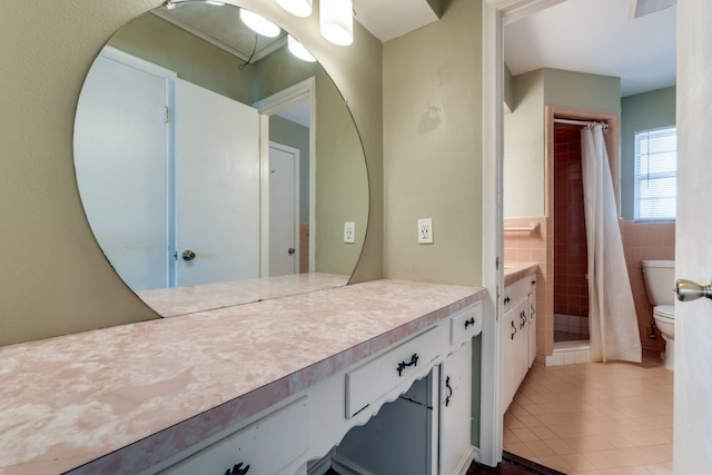 bathroom with tile patterned floors, tile walls, toilet, vanity, and a shower with shower curtain