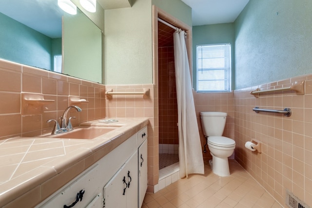 bathroom with tile walls, toilet, a shower with shower curtain, and tile patterned flooring