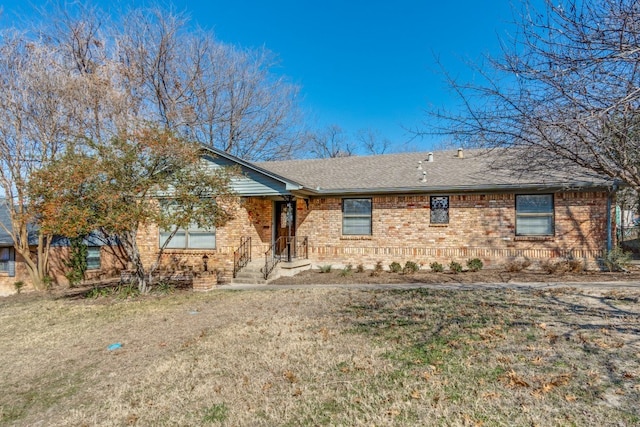 ranch-style home with a front lawn