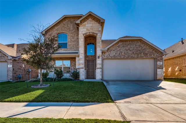 view of front property featuring a garage and a front lawn