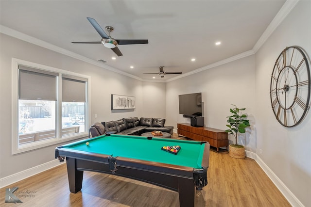 game room with crown molding, light hardwood / wood-style flooring, billiards, and ceiling fan