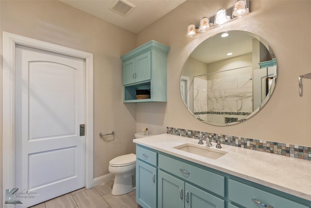 bathroom with toilet, tasteful backsplash, walk in shower, and vanity