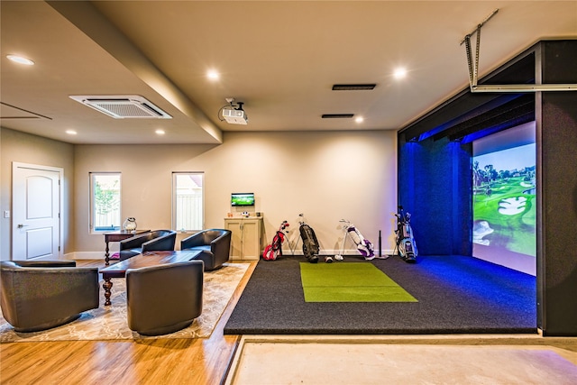 rec room featuring golf simulator and hardwood / wood-style flooring