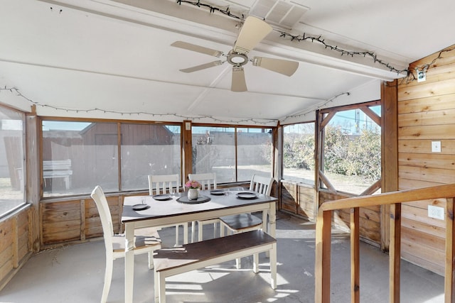 sunroom / solarium featuring ceiling fan