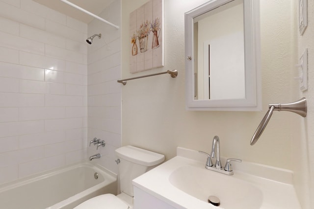 full bathroom with vanity, toilet, and tiled shower / bath