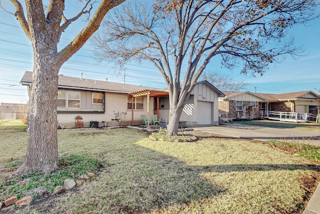 ranch-style house featuring a garage and a front yard