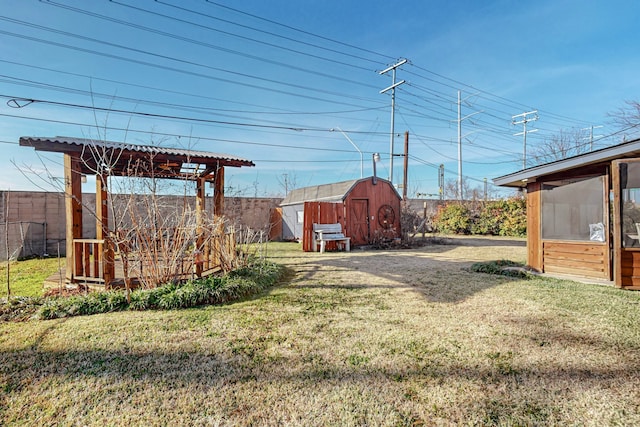 view of yard with a storage unit