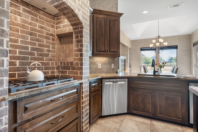 kitchen with dark brown cabinets, dishwasher, stone counters, and a notable chandelier